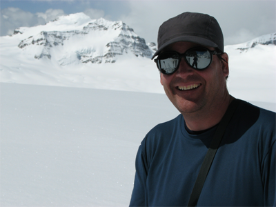 Jerry Auld on Mt. Gordon with Mt. Collie in the distance.